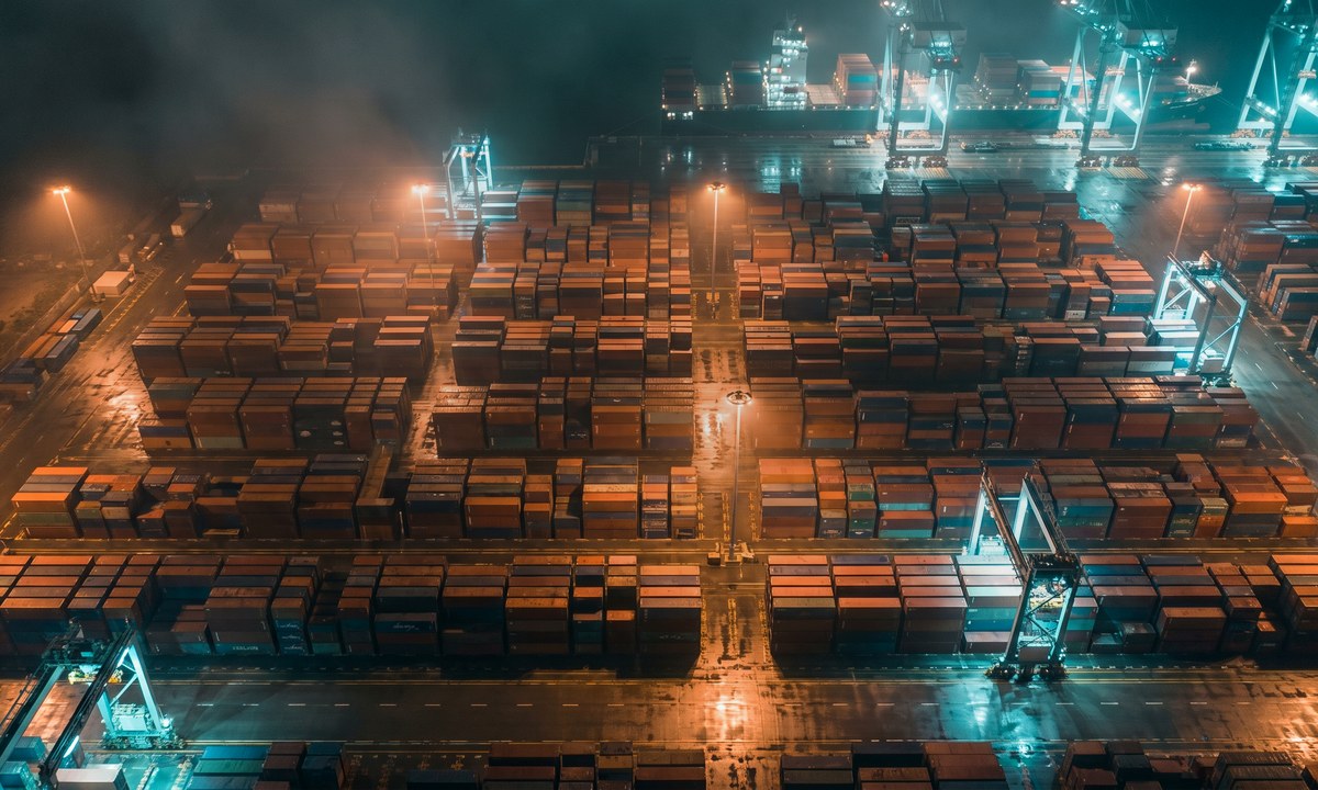 Aerial view of a stacked container yard at port