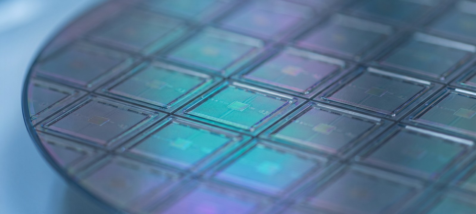 Macro photograph of microchips on a PCB — silicon at process scale